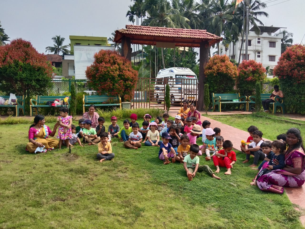 Children enjoying an outdoor preschool activity at Makkala Mane